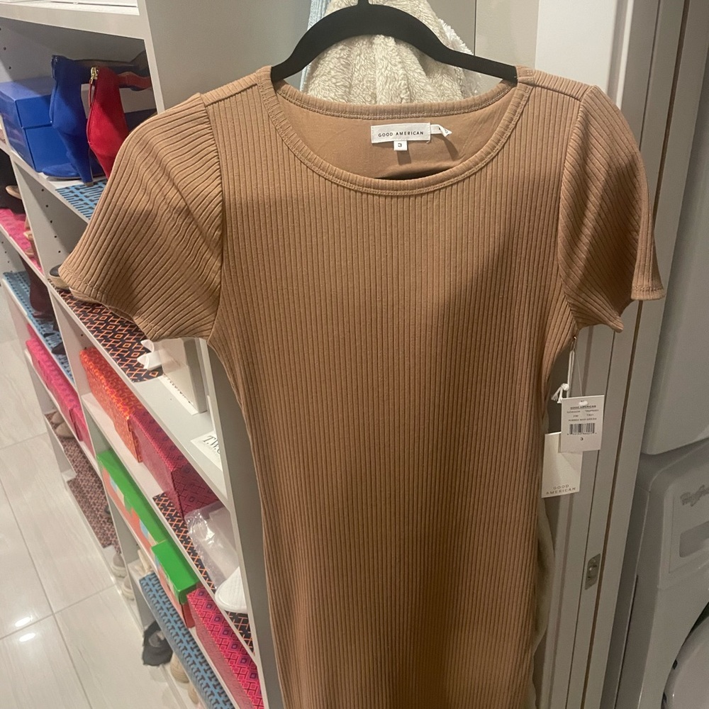 MIDI dress semi body fit, but an A line style towards the bottom.